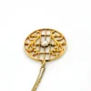 Antique Edwardian round openwork pendant necklace in warm rose gold filled with a likely natural pearl center on a 16-inch chain.