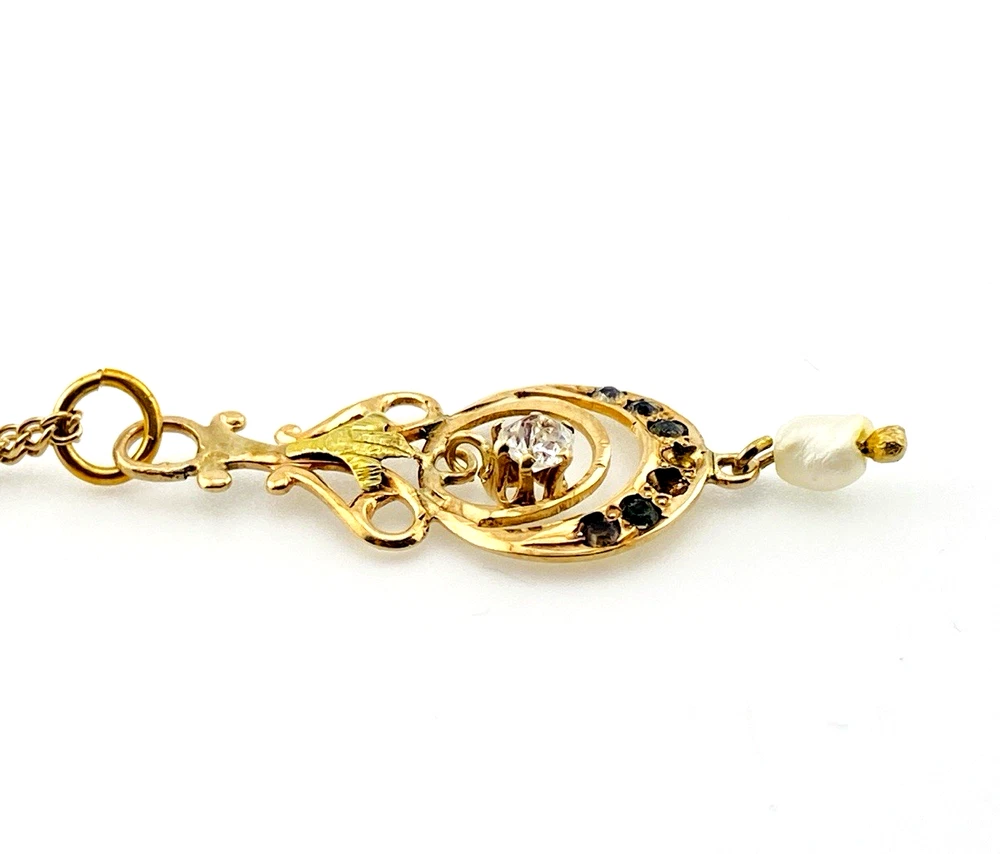 Antique Edwardian solid 9K gold lavaliere pendant with a diamond simulant center, natural baroque pearl drop, and later 12K gold filled chain.