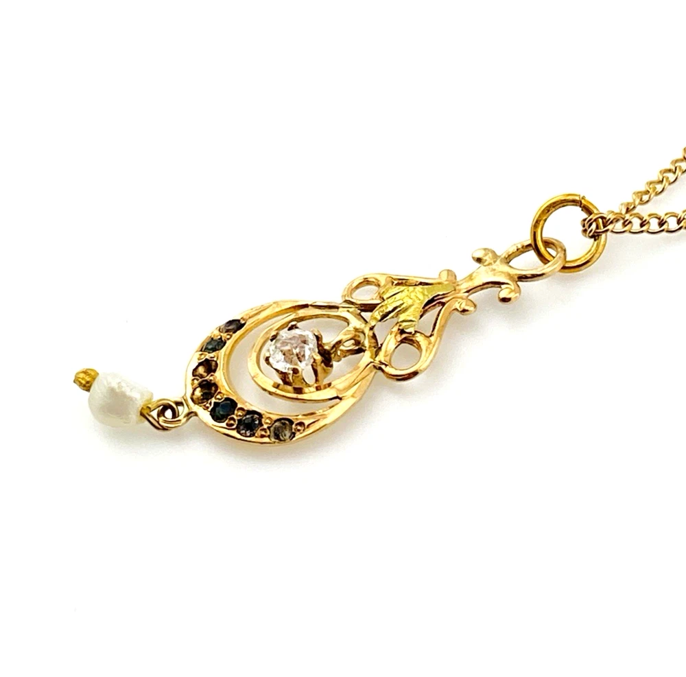 Antique Edwardian solid 9K gold lavaliere pendant with a diamond simulant center, natural baroque pearl drop, and later 12K gold filled chain.