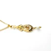Antique Edwardian solid 9K gold lavaliere pendant with a diamond simulant center, natural baroque pearl drop, and later 12K gold filled chain.