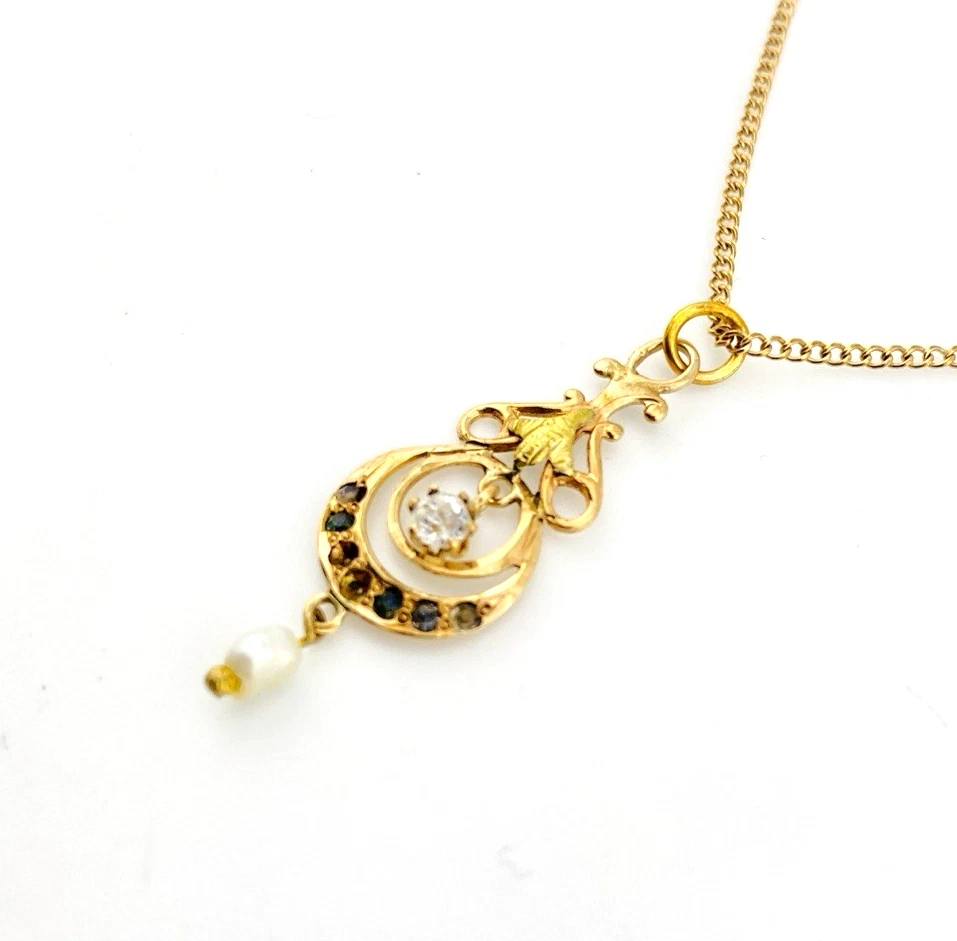 Antique Edwardian solid 9K gold lavaliere pendant with a diamond simulant center, natural baroque pearl drop, and later 12K gold filled chain.