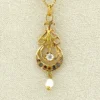Antique Edwardian solid 9K gold lavaliere pendant with a diamond simulant center, natural baroque pearl drop, and later 12K gold filled chain.