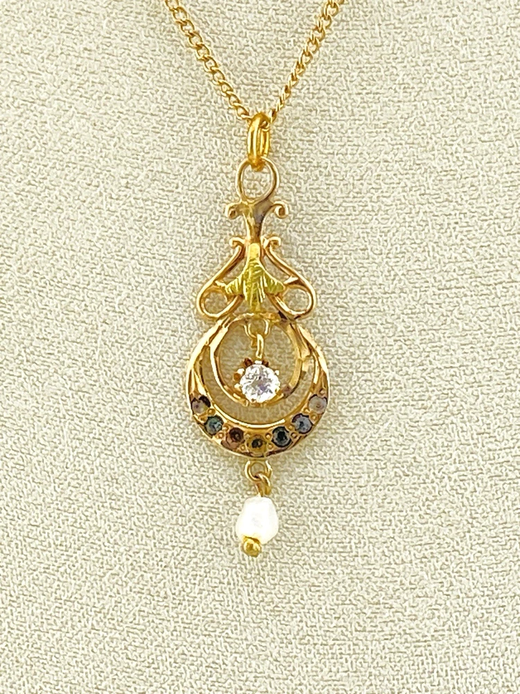 Antique Edwardian solid 9K gold lavaliere pendant with a diamond simulant center, natural baroque pearl drop, and later 12K gold filled chain.