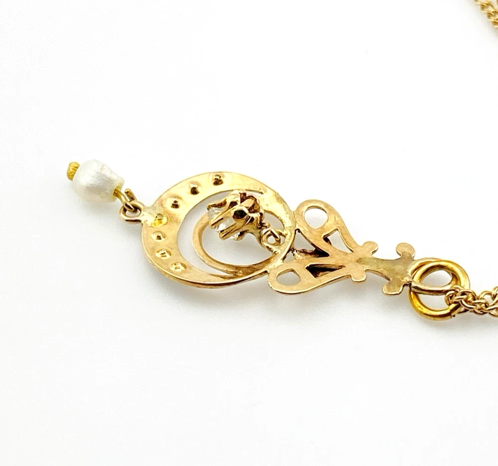 Antique Edwardian solid 9K gold lavaliere pendant with a diamond simulant center, natural baroque pearl drop, and later 12K gold filled chain.