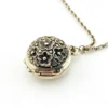 WWII-era sterling silver forget-me-not locket opened to reveal four original family photographs