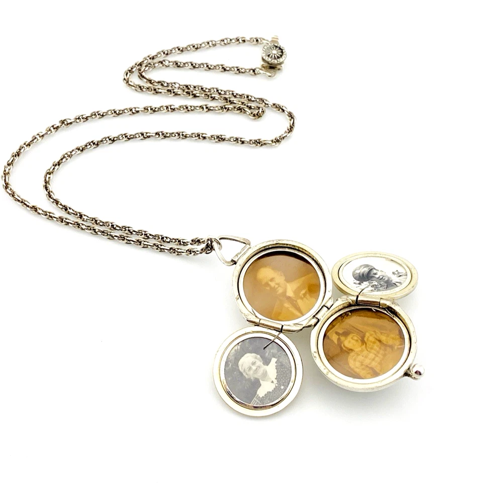 WWII-era sterling silver forget-me-not locket opened to reveal four original family photographs