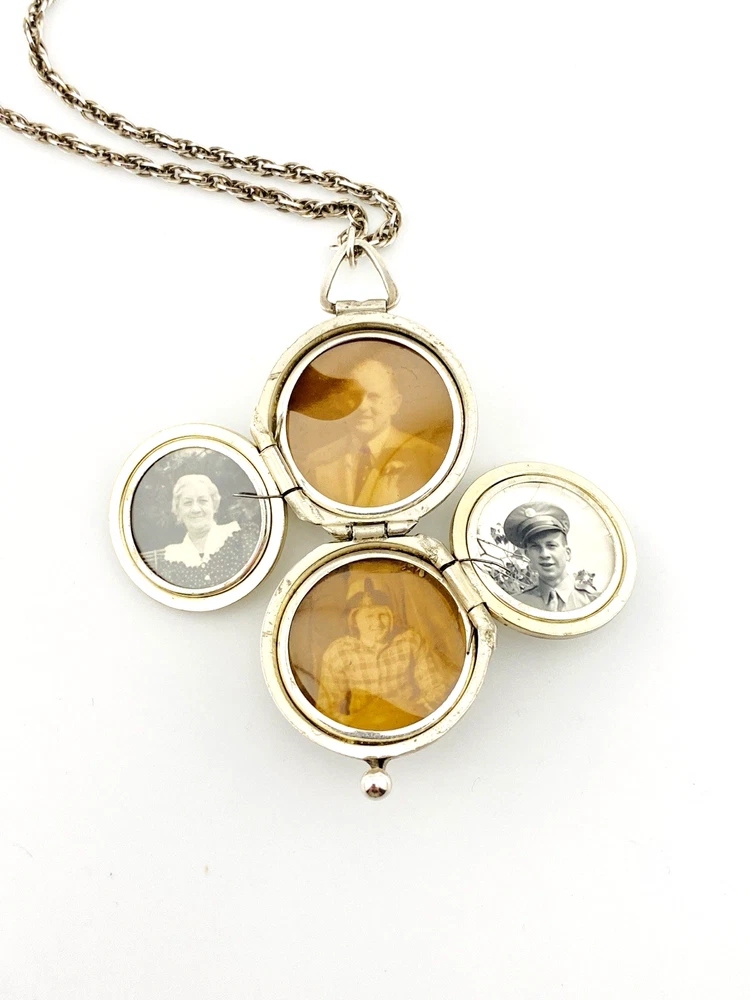 WWII-era sterling silver forget-me-not locket opened to reveal four original family photographs