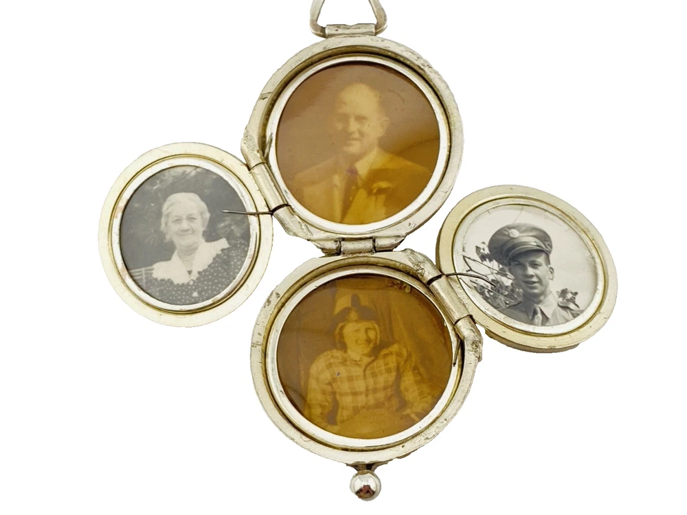 WWII-era sterling silver forget-me-not locket opened to reveal four original family photographs