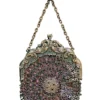 Antique silver-colored chatelaine purse with openwork metal, purple silk lining, fringe, and fleur-de-lis belt clip
