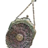 Antique silver-colored chatelaine purse with openwork metal, purple silk lining, fringe, and fleur-de-lis belt clip