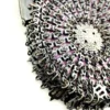 Antique silver-colored chatelaine purse with openwork metal, purple silk lining, fringe, and fleur-de-lis belt clip