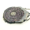 Antique silver-colored chatelaine purse with openwork metal, purple silk lining, fringe, and fleur-de-lis belt clip