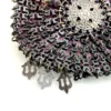 Antique silver-colored chatelaine purse with openwork metal, purple silk lining, fringe, and fleur-de-lis belt clip