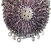 Antique silver-colored chatelaine purse with openwork metal, purple silk lining, fringe, and fleur-de-lis belt clip