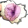 Antique silver-colored chatelaine purse with openwork metal, purple silk lining, fringe, and fleur-de-lis belt clip