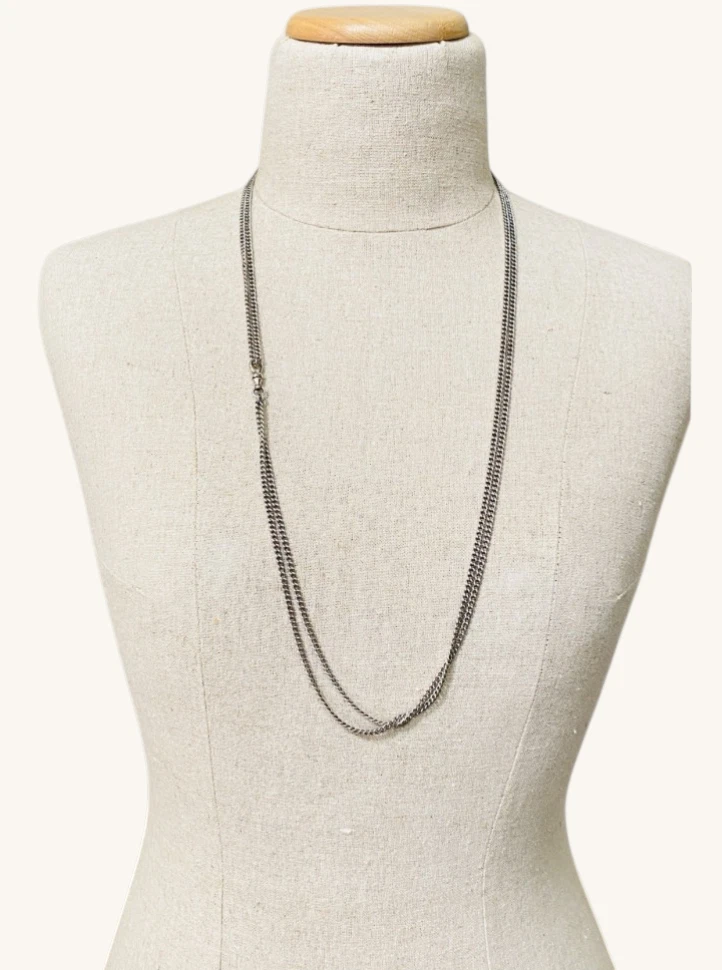Vintage 63-inch sterling silver curb-link long guard chain with dog clip arranged in three graduated layers