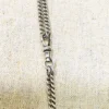 Vintage 63-inch sterling silver curb-link long guard chain with dog clip arranged in three graduated layers