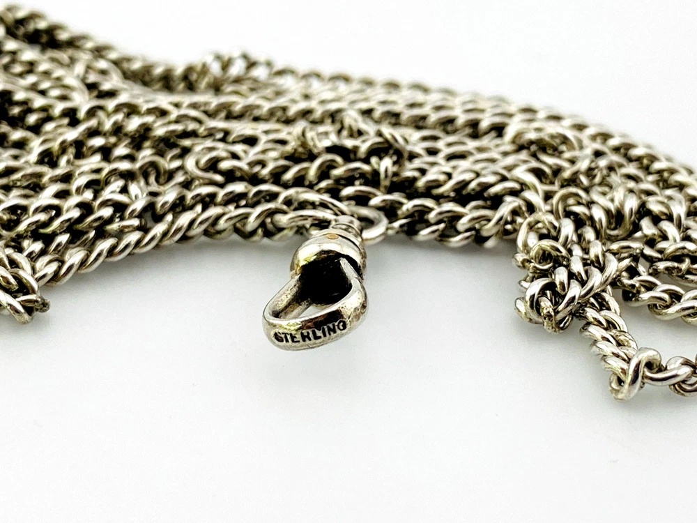 Vintage 63-inch sterling silver curb-link long guard chain with dog clip arranged in three graduated layers