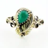 Vintage size 9.75 Southwestern sterling silver ring with teardrop turquoise, engraved leaf, scrolls, and sunburst-stamped silver drop