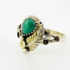 Vintage size 9.75 Southwestern sterling silver ring with teardrop turquoise, engraved leaf, scrolls, and sunburst-stamped silver drop