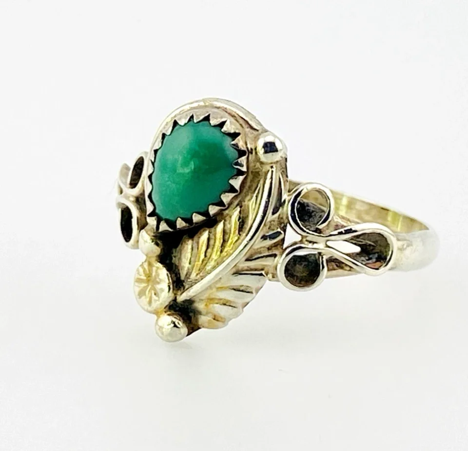 Vintage size 9.75 Southwestern sterling silver ring with teardrop turquoise, engraved leaf, scrolls, and sunburst-stamped silver drop