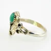 Vintage size 9.75 Southwestern sterling silver ring with teardrop turquoise, engraved leaf, scrolls, and sunburst-stamped silver drop