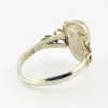 Vintage size 9.75 Southwestern sterling silver ring with teardrop turquoise, engraved leaf, scrolls, and sunburst-stamped silver drop