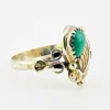 Vintage size 9.75 Southwestern sterling silver ring with teardrop turquoise, engraved leaf, scrolls, and sunburst-stamped silver drop