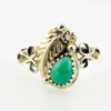 Vintage size 9.75 Southwestern sterling silver ring with teardrop turquoise, engraved leaf, scrolls, and sunburst-stamped silver drop