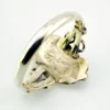 Vintage size 9.75 Southwestern sterling silver ring with teardrop turquoise, engraved leaf, scrolls, and sunburst-stamped silver drop