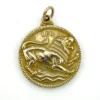 Vintage Medallic Art Co. silver-plated Leo zodiac medal pendant with a roaring lion in deep sculptural relief