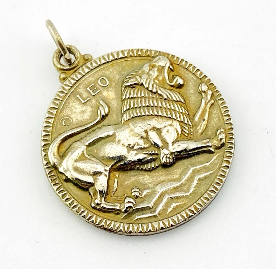 Vintage Medallic Art Co. silver-plated Leo zodiac medal pendant with a roaring lion in deep sculptural relief