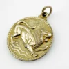 Vintage Medallic Art Co. silver-plated Leo zodiac medal pendant with a roaring lion in deep sculptural relief