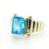 Emerald-cut blue topaz sterling silver ring with fluted architectural shoulders, signed LP, size 7.75