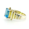 Emerald-cut blue topaz sterling silver ring with fluted architectural shoulders, signed LP, size 7.75