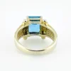 Emerald-cut blue topaz sterling silver ring with fluted architectural shoulders, signed LP, size 7.75