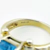 Emerald-cut blue topaz sterling silver ring with fluted architectural shoulders, signed LP, size 7.75