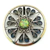Circular vintage RN Mexican sterling silver brooch pendant with green, blue, and gold dichroic glass cabochon and radial wirework