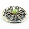 Circular vintage RN Mexican sterling silver brooch pendant with green, blue, and gold dichroic glass cabochon and radial wirework