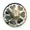 Circular vintage RN Mexican sterling silver brooch pendant with green, blue, and gold dichroic glass cabochon and radial wirework
