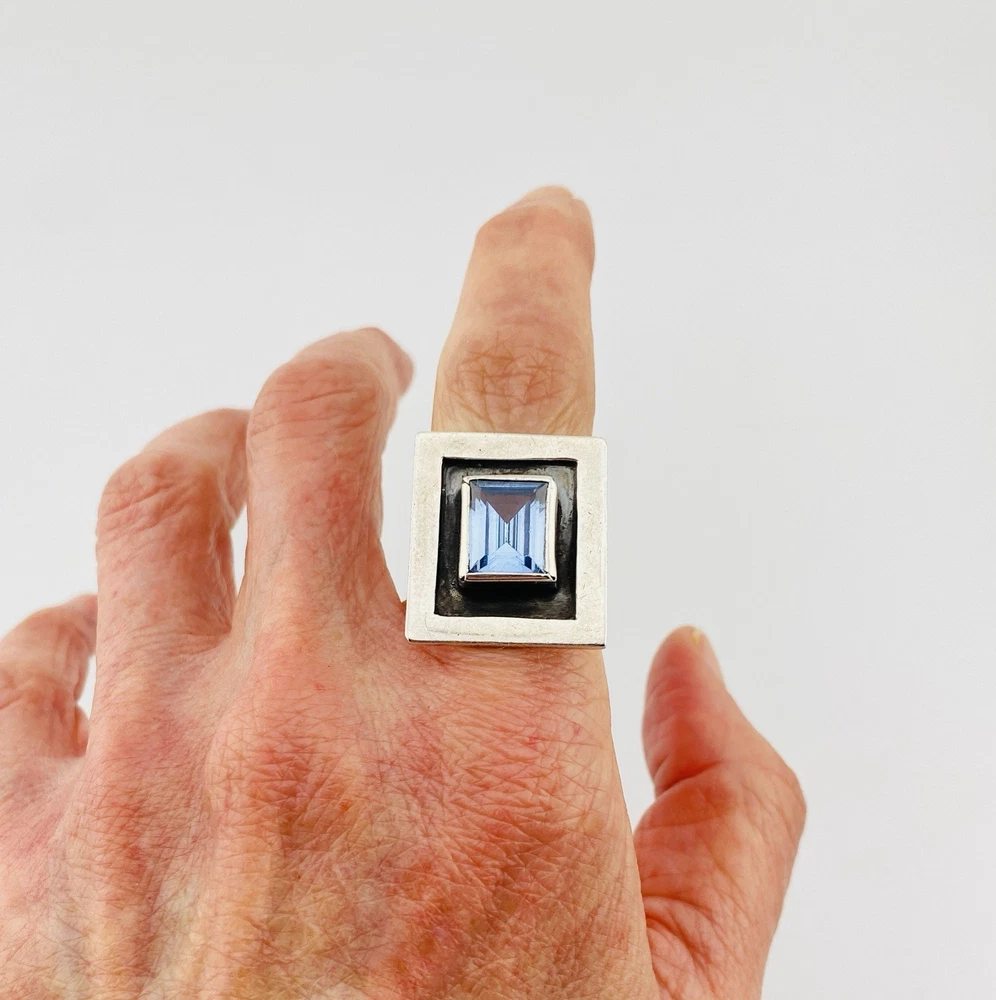 Geometric sterling silver panel ring with emerald-cut Swiss blue topaz