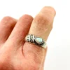 Asymmetrical sterling silver band with teardrop opal and pyramid-cut marcasites