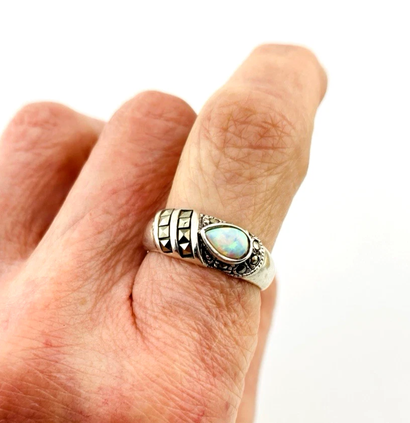 Asymmetrical sterling silver band with teardrop opal and pyramid-cut marcasites
