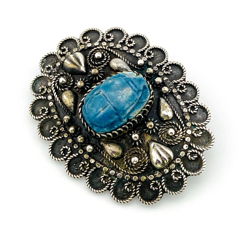 Blue faience scarab set in an ornate Egyptian 800 silver filigree brooch