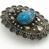 Blue faience scarab set in an ornate Egyptian 800 silver filigree brooch