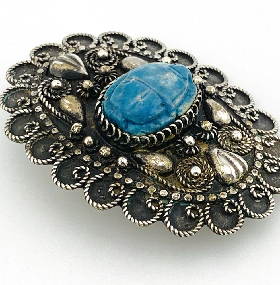 Blue faience scarab set in an ornate Egyptian 800 silver filigree brooch