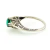 1920s sterling silver filigree ring with a round faceted emerald-green glass stone