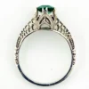 1920s sterling silver filigree ring with a round faceted emerald-green glass stone