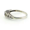 Sterling silver ring with a round blue sapphire, diamond accents and openwork shoulders