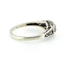 Sterling silver ring with a round blue sapphire, diamond accents and openwork shoulders